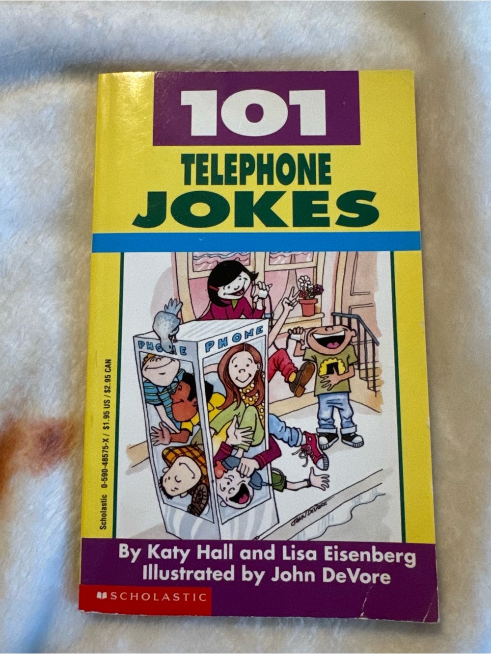 Yellow '101 Telephone Jokes' Paperback Book by Scholastic
